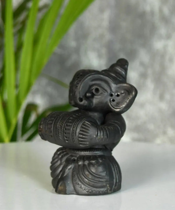 Melodic Mastery: Black Terracotta Ganesh and Tabla Ensemble — image 4