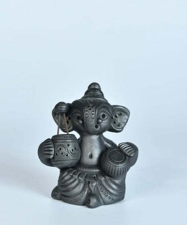 Serene Rhythms: Black Terracotta Ganesh Playing Iktara and Tabla — image 5