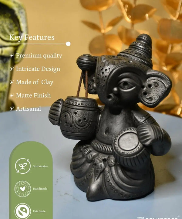 Serene Rhythms: Black Terracotta Ganesh Playing Iktara and Tabla — image 6