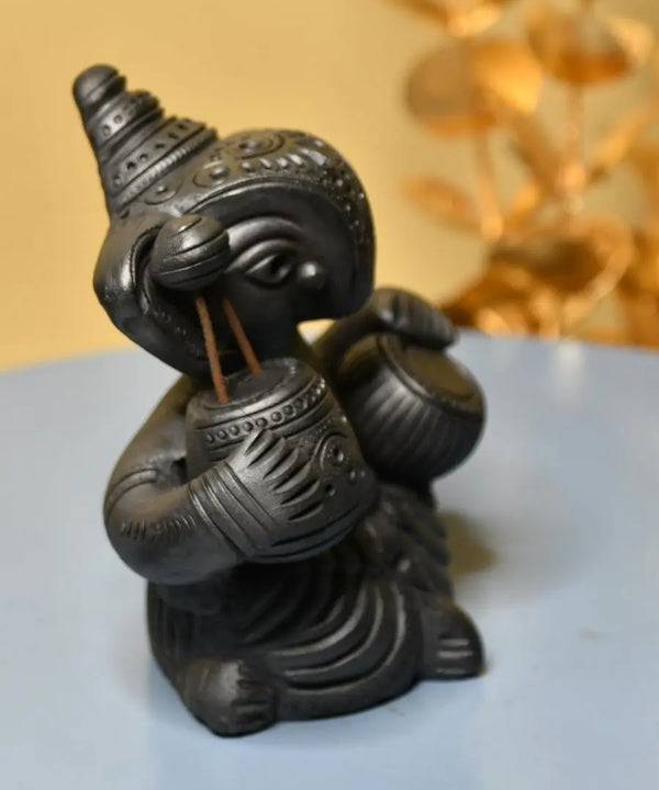 Serene Rhythms: Black Terracotta Ganesh Playing Iktara and Tabla — image 4