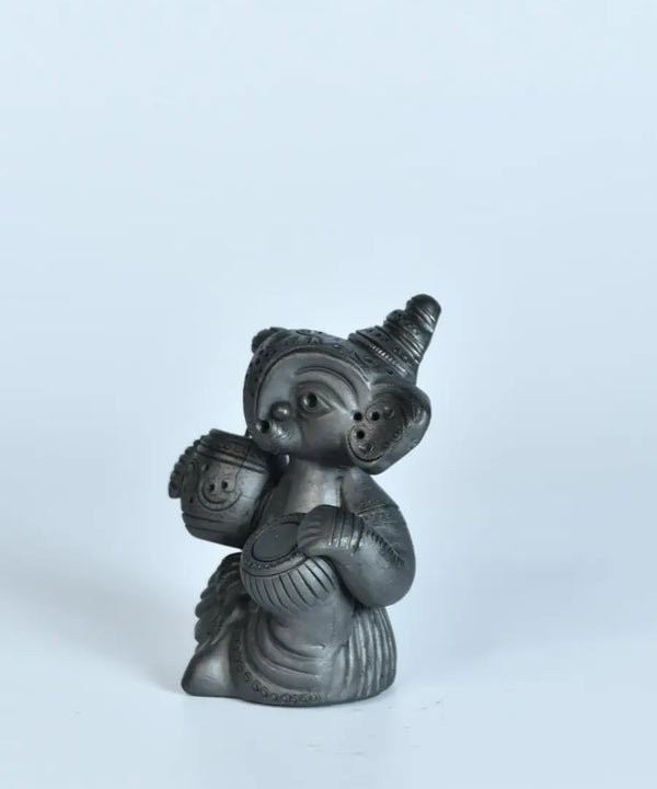 Serene Rhythms: Black Terracotta Ganesh Playing Iktara and Tabla — image 3