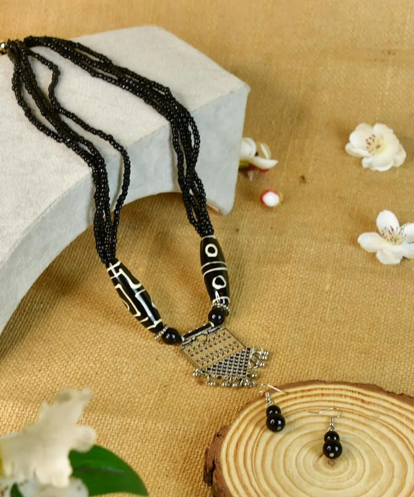 Sowpeace Handcrafted German Silver Necklace: Black Beads & Dzi Pendant — main view