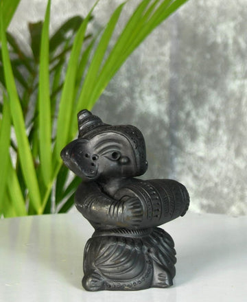 Melodic Mastery: Black Terracotta Ganesh and Tabla Ensemble — alternate view
