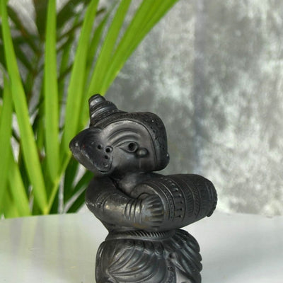 Melodic Mastery: Black Terracotta Ganesh and Tabla Ensemble