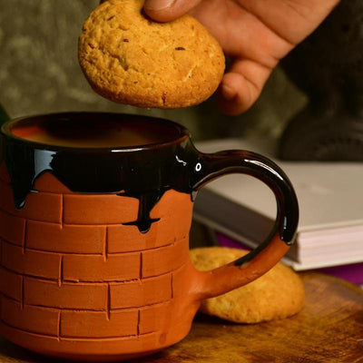 Sculpted Terracotta Coffee Mug: Stylish Functionality