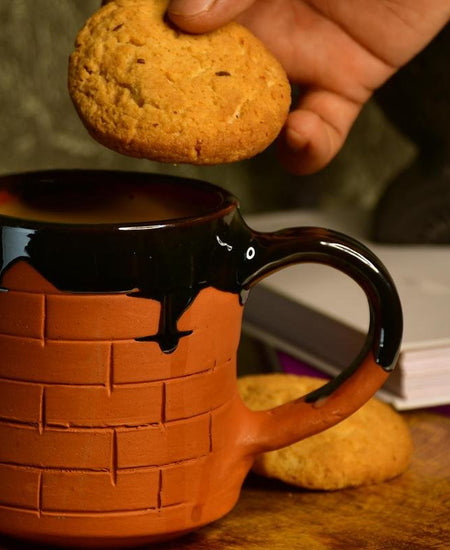 Sculpted Terracotta Coffee Mug: Stylish Functionality
