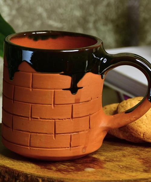 Sculpted Terracotta Coffee Mug: Stylish Functionality