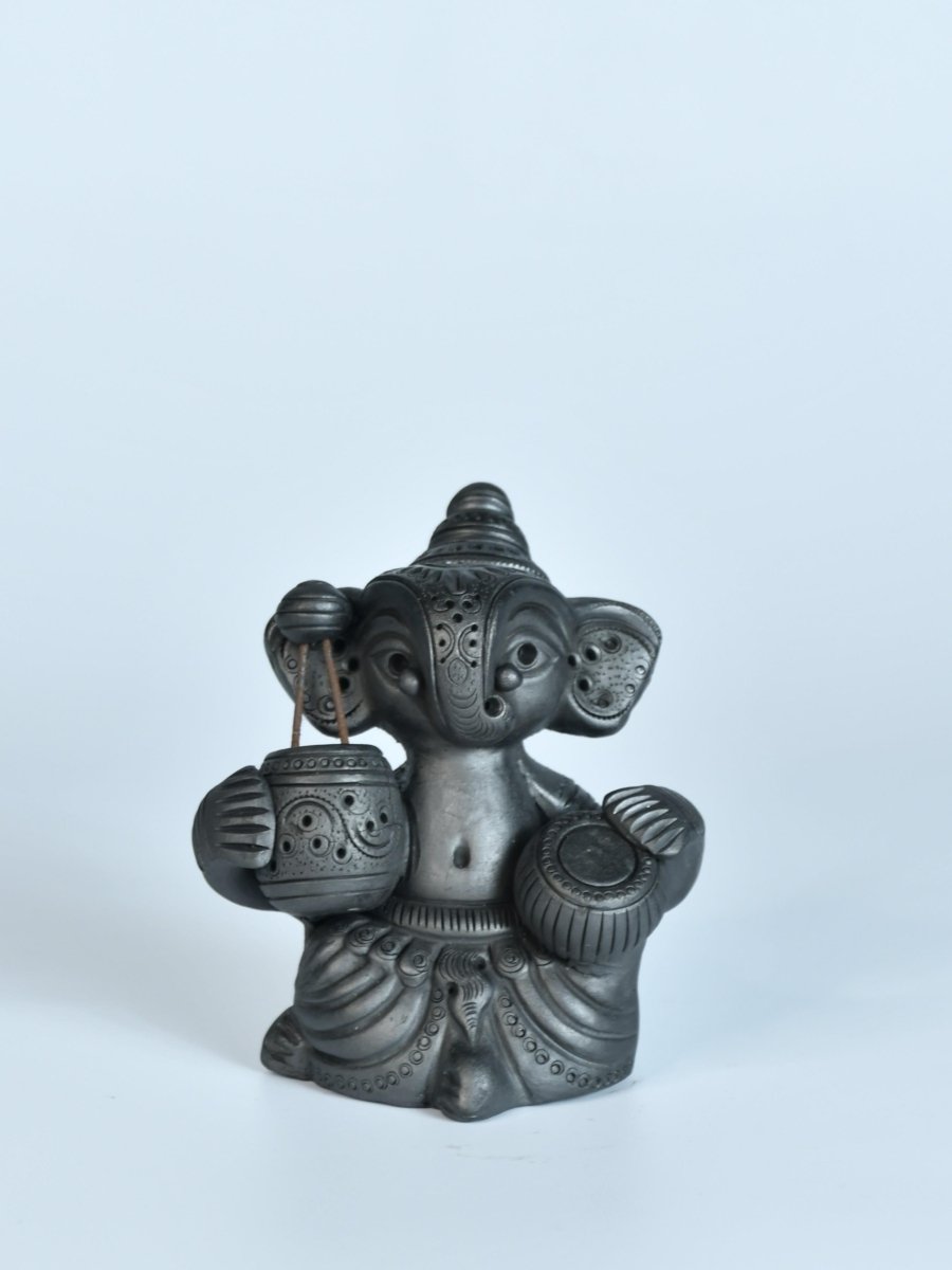 Serene Rhythms: Black Terracotta Ganesh Playing Iktara and Tabla