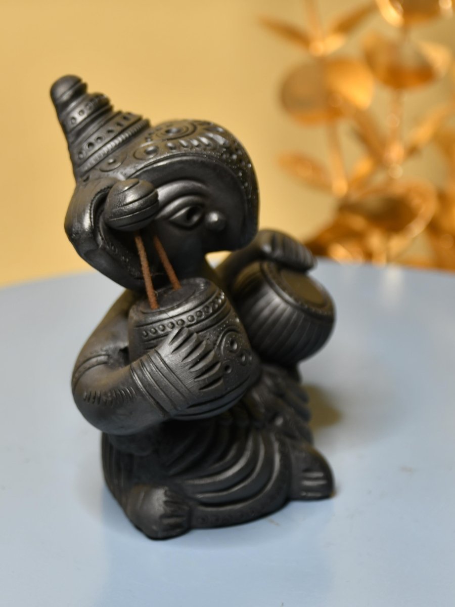 Serene Rhythms: Black Terracotta Ganesh Playing Iktara and Tabla