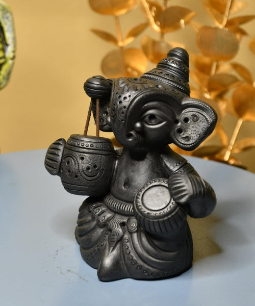Serene Rhythms: Black Terracotta Ganesh Playing Iktara and Tabla