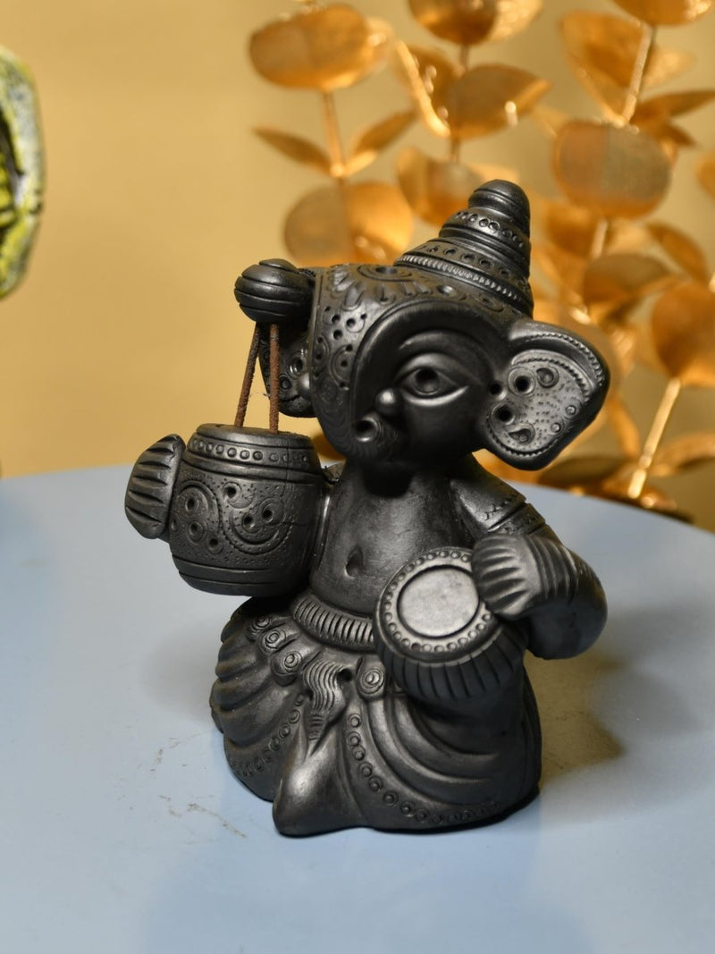 Serene Rhythms: Black Terracotta Ganesh Playing Iktara and Tabla – view 1