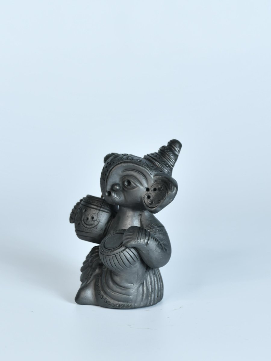 Serene Rhythms: Black Terracotta Ganesh Playing Iktara and Tabla