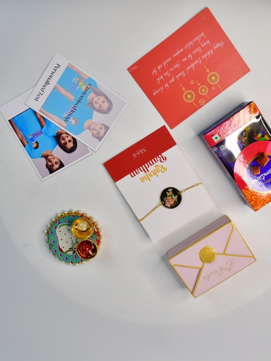 Sowpeace Exquisite Bhai Behen Rakhi Pack of 1 with Roli Chawal Thali, Chocolates, Poloroids and Greeting card combo for Raksha Bandhan and Gifting