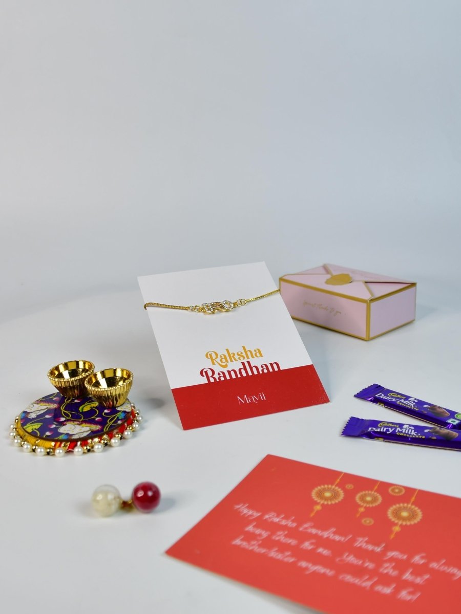 Sowpeace Exquisite BRO Rakhi Pack of 1 with Roli Chawal Thali, two Chocolates, and Greeting card combo for Raksha Bandhan and Gifting