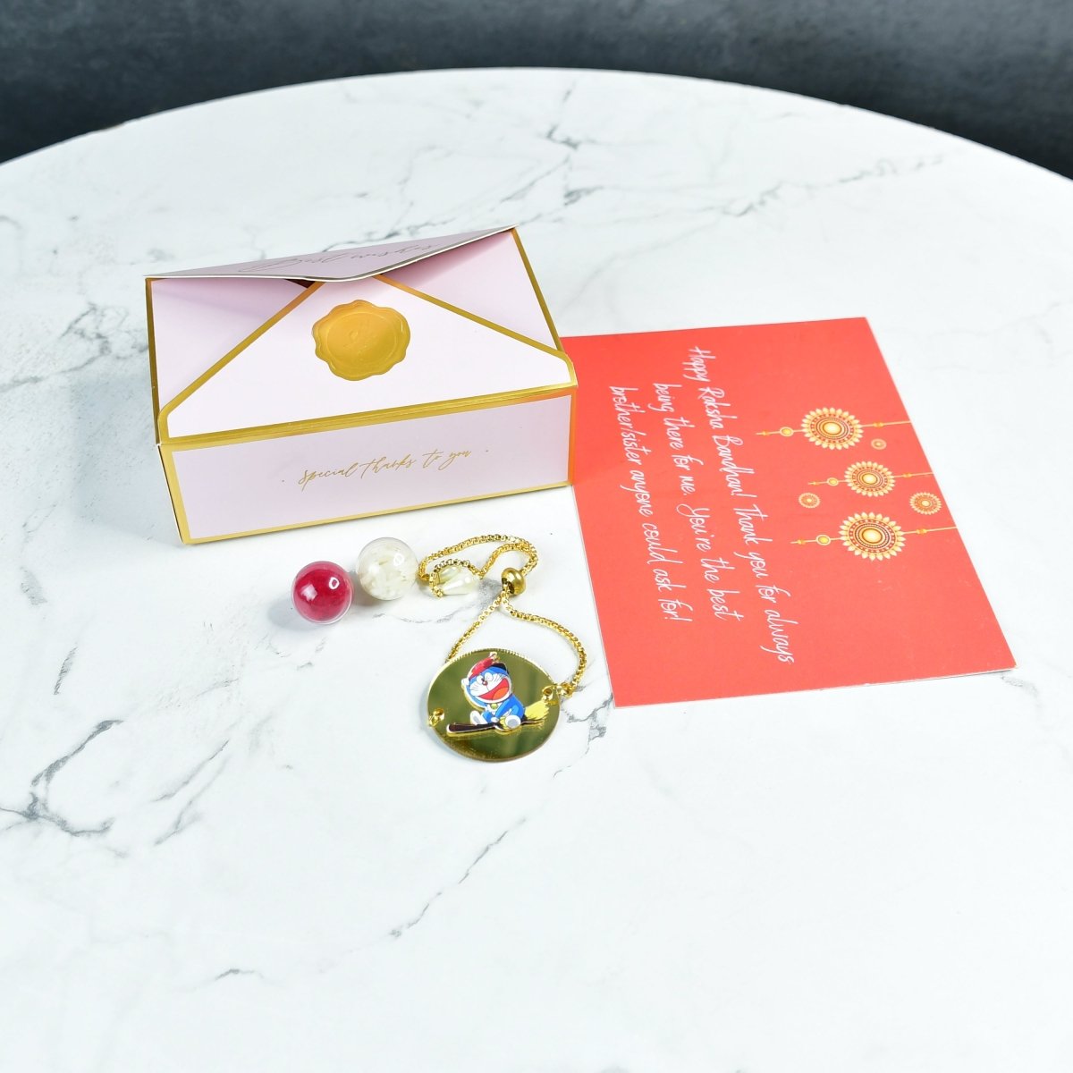 Sowpeace Exquisite Doraemon Rakhi Pack of 1 with Roli Chawal and Greeting card combo for Raksha Bandhan and Gifting