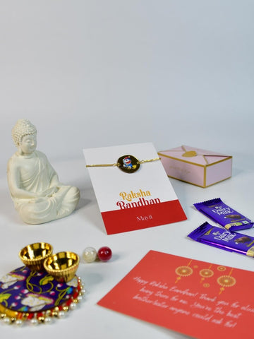 Sowpeace Exquisite Doraemon Rakhi Pack of 1 with Roli Chawal Thali, Chocolates, Buddha and Greeting card combo for Raksha Bandhan and Gifting - Rakhi - Sowpeace - Default Title - RAK - DORA - HND - P4 - Sowpeace