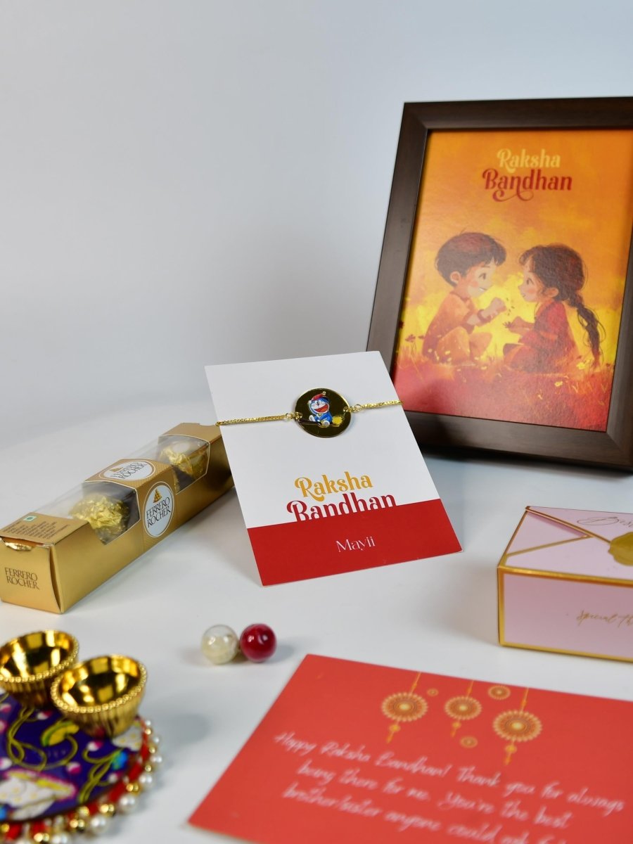 Sowpeace Exquisite Doraemon Rakhi Pack of 1 with Roli Chawal Thali, Chocolates, Photo Frame and Greeting card combo for Raksha Bandhan and Gifting - Rakhi - Sowpeace - Default Title - RAK - DORA - HND - P6 - Sowpeace