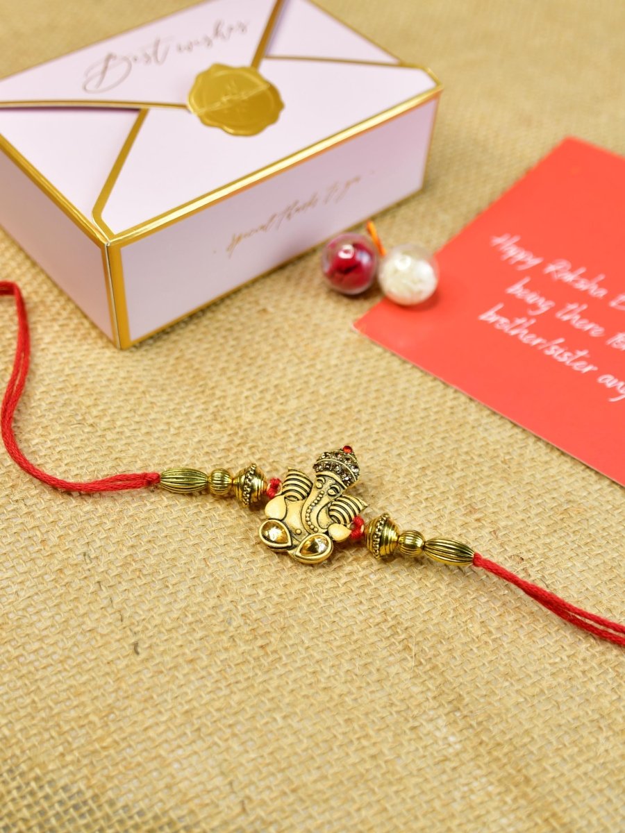 Sowpeace Exquisite Golden Ganesha Rakhi Pack of 1 with Roli Chawal and Greeting card combo for Raksha Bandhan and Gifting - Rakhi - Sowpeace - Default Title - RAK - GNS - HND - P1 - Sowpeace