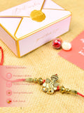 Sowpeace Exquisite Golden Ganesha Rakhi Pack of 1 with Roli Chawal and Greeting card combo for Raksha Bandhan and Gifting - Rakhi - Sowpeace - Sowpeace Exquisite Golden Ganesha Rakhi Pack of 1 with Roli Chawal and Greeting card combo for Raksha Bandhan and Gifting - RAK - GNS - HND - P1 - Sowpeace