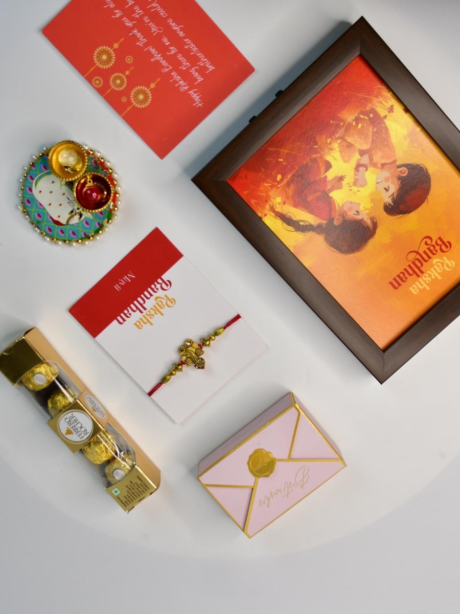 Sowpeace Exquisite Golden Ganesha Rakhi Pack of 1 with Roli Chawal Thali, Chocolates, Photo Frame and Greeting card combo for Raksha Bandhan and Gifting