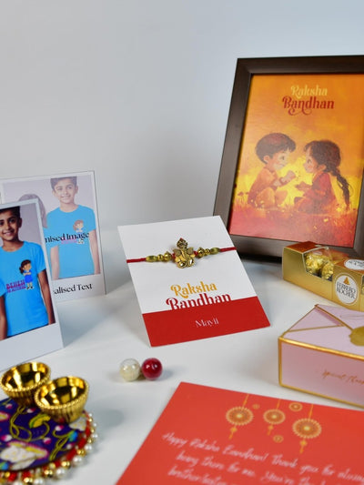 Sowpeace Exquisite Golden Ganesha Rakhi Pack of 1 with Roli Chawal Thali, Chocolates, Photo Frame, Poloroids and Greeting card combo for Raksha Bandhan and Gifting