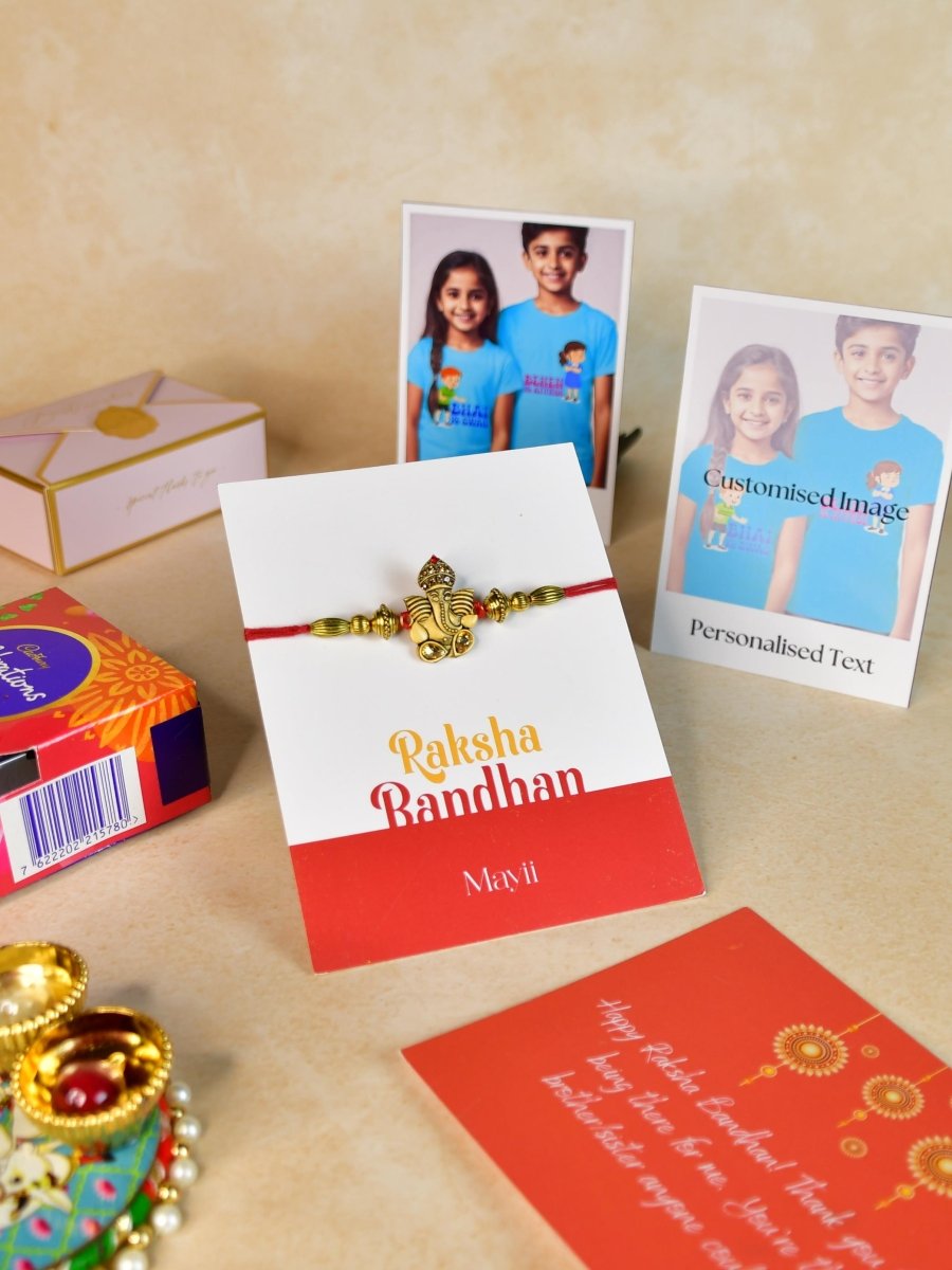 Sowpeace Exquisite Golden Ganesha Rakhi Pack of 1 with Roli Chawal Thali, Chocolates, Poloroids and Greeting card combo for Raksha Bandhan and Gifting - Rakhi - Sowpeace - Default Title - RAK - GNS - HND - P5 - Sowpeace