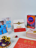 Sowpeace Exquisite Golden Ganesha Rakhi Pack of 1 with Roli Chawal Thali, Chocolates, Poloroids and Greeting card combo for Raksha Bandhan and Gifting - Rakhi - Sowpeace - Default Title - RAK - GNS - HND - P5 - Sowpeace