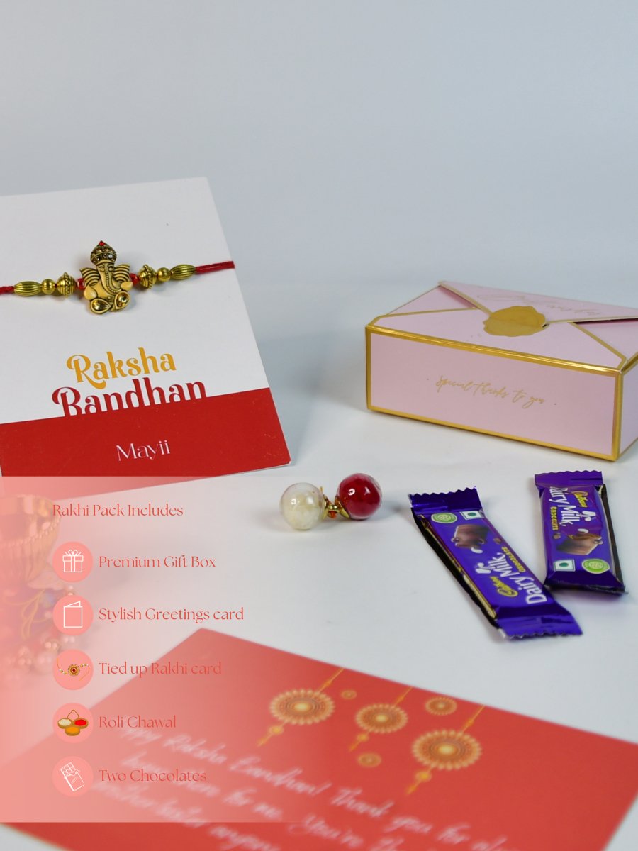 Sowpeace Exquisite Golden Ganesha Rakhi Pack of 1 with Roli Chawal Thali, two Chocolates, and Greeting card combo for Raksha Bandhan and Gifting - Rakhi - Sowpeace - Sowpeace Exquisite Golden Ganesha Rakhi Pack of 1 with Roli Chawal Thali, two Chocolates, and Greeting card combo for Raksha Bandhan and Gifting - RAK - GNS - HND - P2 - Sowpeace