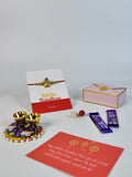 Sowpeace Exquisite Golden Ganesha Rakhi Pack of 1 with Roli Chawal Thali, two Chocolates, and Greeting card combo for Raksha Bandhan and Gifting - Rakhi - Sowpeace - Sowpeace Exquisite Golden Ganesha Rakhi Pack of 1 with Roli Chawal Thali, two Chocolates, and Greeting card combo for Raksha Bandhan and Gifting - RAK - GNS - HND - P2 - Sowpeace