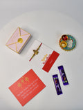 Sowpeace Exquisite Golden Ganesha Rakhi Pack of 1 with Roli Chawal Thali, two Chocolates, and Greeting card combo for Raksha Bandhan and Gifting - Rakhi - Sowpeace - Sowpeace Exquisite Golden Ganesha Rakhi Pack of 1 with Roli Chawal Thali, two Chocolates, and Greeting card combo for Raksha Bandhan and Gifting - RAK - GNS - HND - P2 - Sowpeace