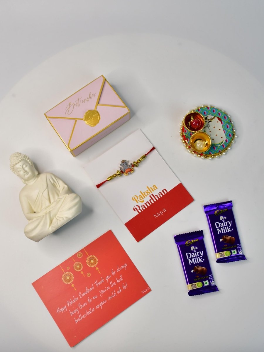 Sowpeace Exquisite Green Ganesha Rakhi Pack of 1 with Roli Chawal Thali, Chocolates, Buddha and Greeting card combo for Raksha Bandhan and Gifting