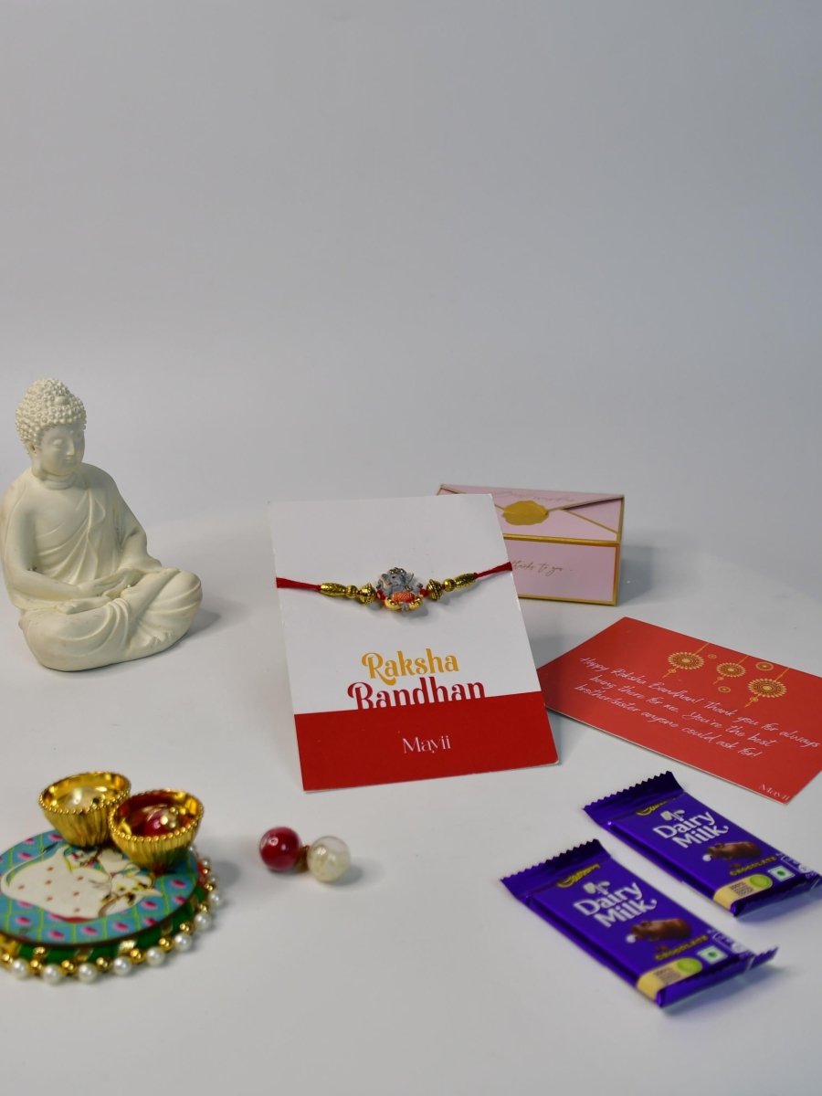 Sowpeace Exquisite Green Ganesha Rakhi Pack of 1 with Roli Chawal Thali, Chocolates, Buddha and Greeting card combo for Raksha Bandhan and Gifting