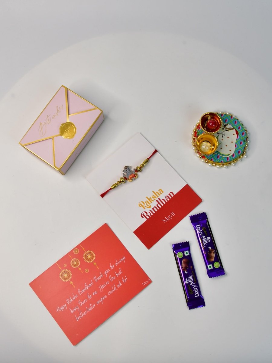 Sowpeace Exquisite Green Ganesha Rakhi Pack of 1 with Roli Chawal Thali, two Chocolates, and Greeting card combo for Raksha Bandhan and Gifting