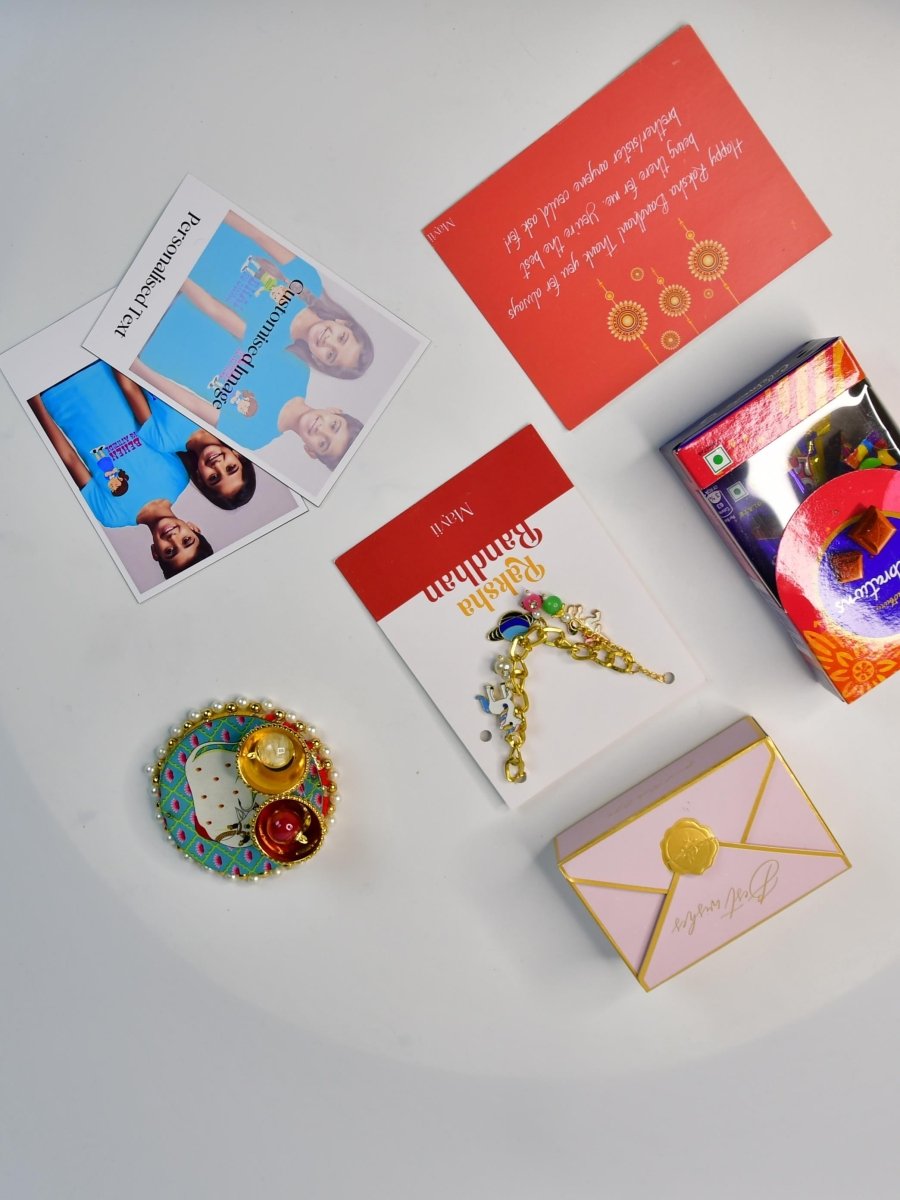 Sowpeace Exquisite Metal Abstract Rakhi Pack of 1 with Roli Chawal Thali, Chocolates, Poloroids and Greeting card combo for Raksha Bandhan and Gifting