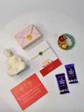 Sowpeace Exquisite Peacock Rakhi Pack of 1 with Roli Chawal Thali, Chocolates, Buddha and Greeting card combo for Raksha Bandhan and Gifting - Rakhi - Sowpeace - Sowpeace Exquisite Peacock Rakhi Pack of 1 with Roli Chawal Thali, Chocolates, Buddha and Greeting card combo for Raksha Bandhan and Gifting - RAK - CIRPK - HND - P4 - Sowpeace