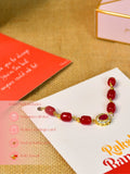 Sowpeace Exquisite Red Beads Rakhi Pack of 1 with Roli Chawal and Greeting card combo for Raksha Bandhan and Gifting - Rakhi - Sowpeace - Sowpeace Exquisite Red Beads Rakhi Pack of 1 with Roli Chawal and Greeting card combo for Raksha Bandhan and Gifting - RAK - REDBD - HND - P1 - Sowpeace