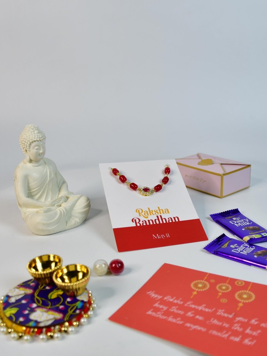 Sowpeace Exquisite Red Beads Rakhi Pack of 1 with Roli Chawal Thali, Chocolates, Buddha and Greeting card combo for Raksha Bandhan and Gifting - Rakhi - Sowpeace - Default Title - RAK - REDBD - HND - P4 - Sowpeace