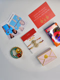 Sowpeace Exquisite Red Centre Flower Rakhi Pack of 1 with Roli Chawal Thali, Chocolates, Poloroids and Greeting card combo for Raksha Bandhan and Gifting - Rakhi - Sowpeace - Sowpeace Exquisite Red Centre Flower Rakhi Pack of 1 with Roli Chawal Thali, Chocolates, Poloroids and Greeting card combo for Raksha Bandhan and Gifting - RAK - CRFL - HND - P5 - Sowpeace