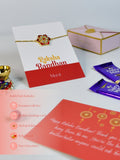 Sowpeace Exquisite Red Flower Rakhi Pack of 1 with Roli Chawal Thali, Chocolates, and Greeting card combo for Raksha Bandhan and Gifting - Rakhi - Sowpeace - Sowpeace Exquisite Red Flower Rakhi Pack of 1 with Roli Chawal Thali, Chocolates, and Greeting card combo for Raksha Bandhan and Gifting - RAK - RDFL - HND - P3 - Sowpeace