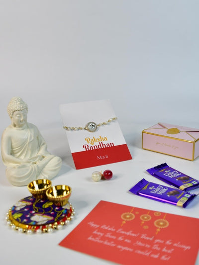 Sowpeace Exquisite Swastik Rakhi Pack of 1 with Roli Chawal Thali, Chocolates, Buddha and Greeting card combo for Raksha Bandhan and Gifting