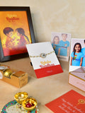 Sowpeace Exquisite Swastik Rakhi Pack of 1 with Roli Chawal Thali, Chocolates, Photo Frame, Poloroids and Greeting card combo for Raksha Bandhan and Gifting - Rakhi - Sowpeace - Default Title - RAK - STK - HND - P7 - Sowpeace