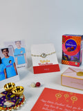 Sowpeace Exquisite Swastik Rakhi Pack of 1 with Roli Chawal Thali, Chocolates, Poloroids and Greeting card combo for Raksha Bandhan and Gifting - Rakhi - Sowpeace - Default Title - RAK - STK - HND - P5 - Sowpeace