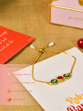 Sowpeace Exquisite Tri Red Green Rakhi Pack of 1 with Roli Chawal and Greeting card combo for Raksha Bandhan and Gifting - Rakhi - Sowpeace - Sowpeace Exquisite Tri Red Green Rakhi Pack of 1 with Roli Chawal and Greeting card combo for Raksha Bandhan and Gifting - RAK - TRIGR - HND - P1 - Sowpeace