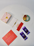 Sowpeace Exquisite Tri Red Green Rakhi Pack of 1 with Roli Chawal Thali, Chocolates, and Greeting card combo for Raksha Bandhan and Gifting - Rakhi - Sowpeace - Sowpeace Exquisite Tri Red Green Rakhi Pack of 1 with Roli Chawal Thali, Chocolates, and Greeting card combo for Raksha Bandhan and Gifting - RAK - TRIGR - HND - P3 - Sowpeace