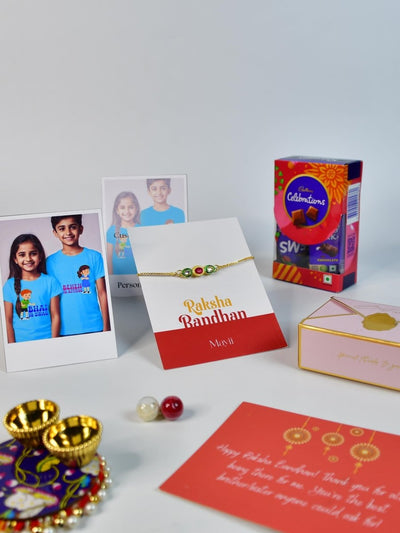 Sowpeace Exquisite Tri Red Green Rakhi Pack of 1 with Roli Chawal Thali, Chocolates, Poloroids and Greeting card combo for Raksha Bandhan and Gifting